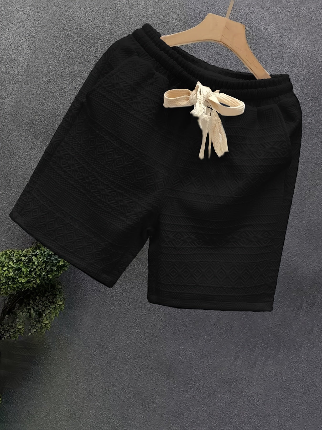 Breathable polyester blend drawstring shorts for men, ideal for summer outings and hiking.