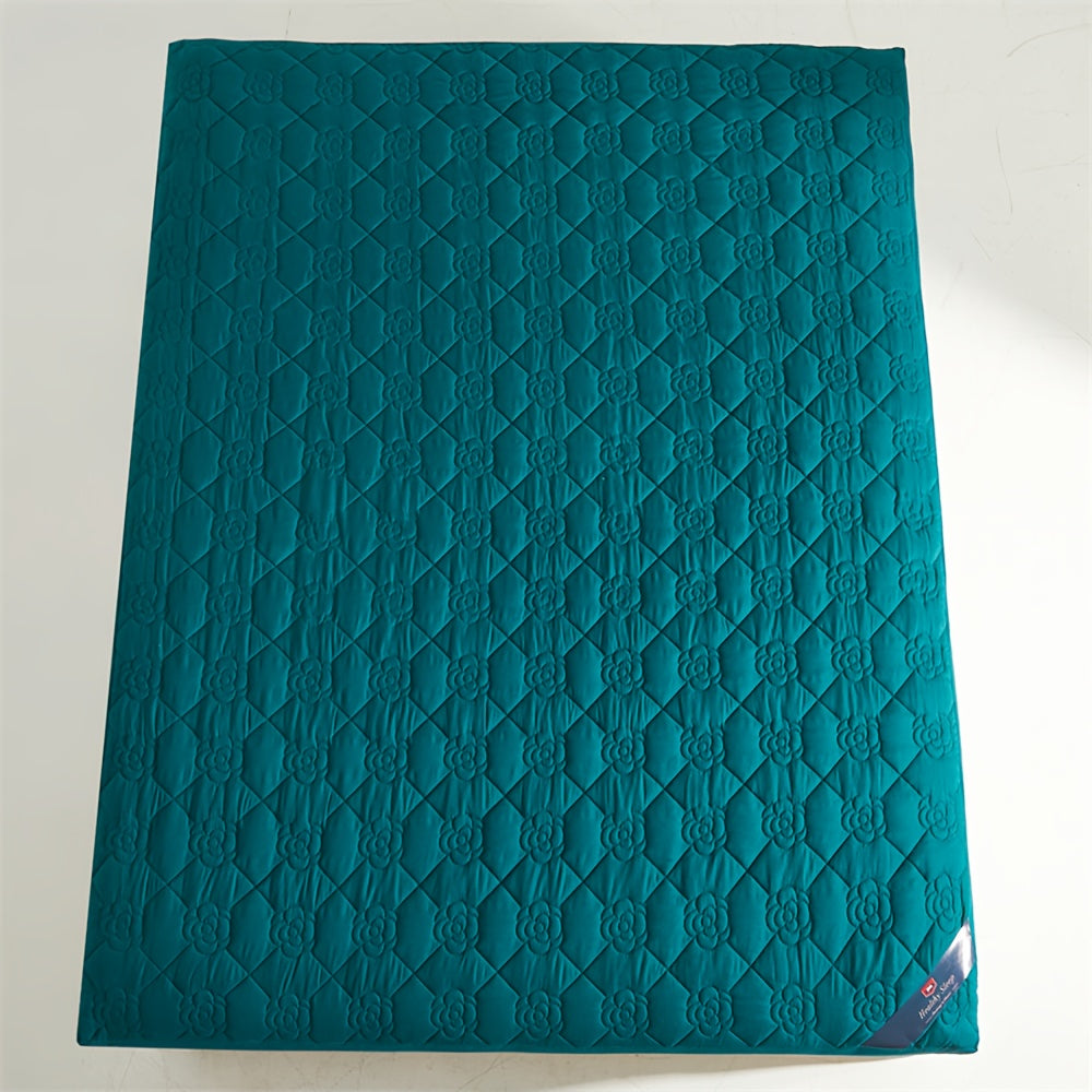 Waterproof mattress protector with soft and breathable soundwave technology fitted sheet in teal green with floral quilted design. Perfect for bedrooms, hotels, and dorm rooms. Made of