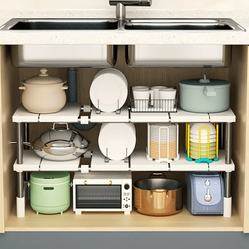 Adjustable plastic under sink organizer shelf with open storage rack for kitchen cabinet. No assembly needed, space-saving solution.