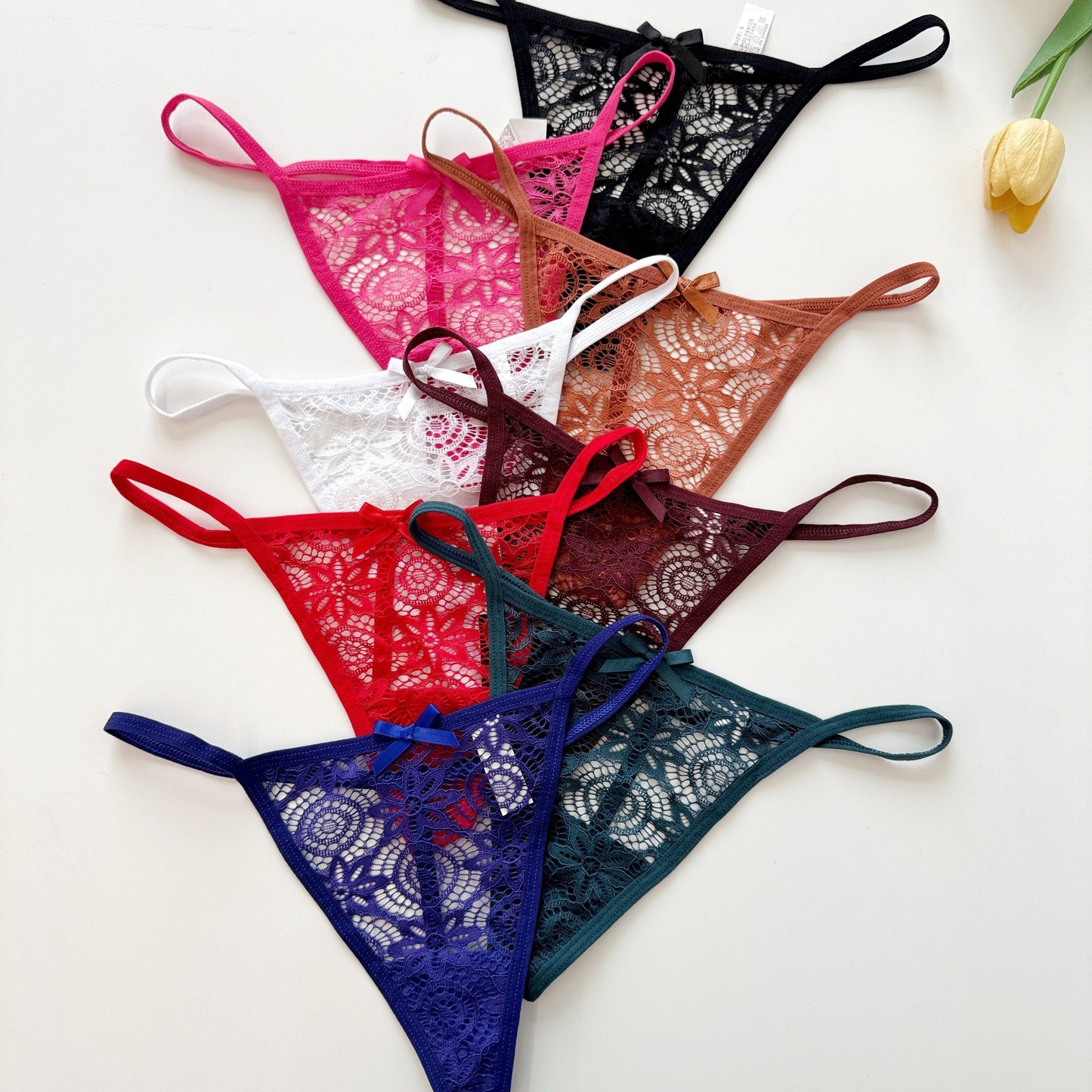 New thin strap low waist thong with lace, bowknot, and see-through design for a comfortable and breathable fit.