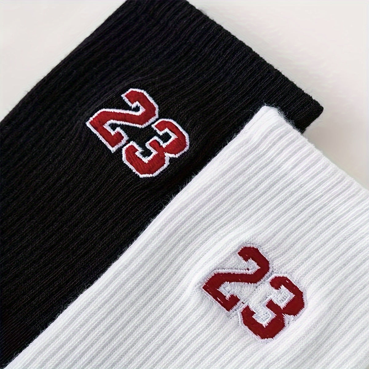 2 pairs of men's short crew socks with a 23 pattern design, breathable and comfortable for casual wear, sports, and outdoor activities.