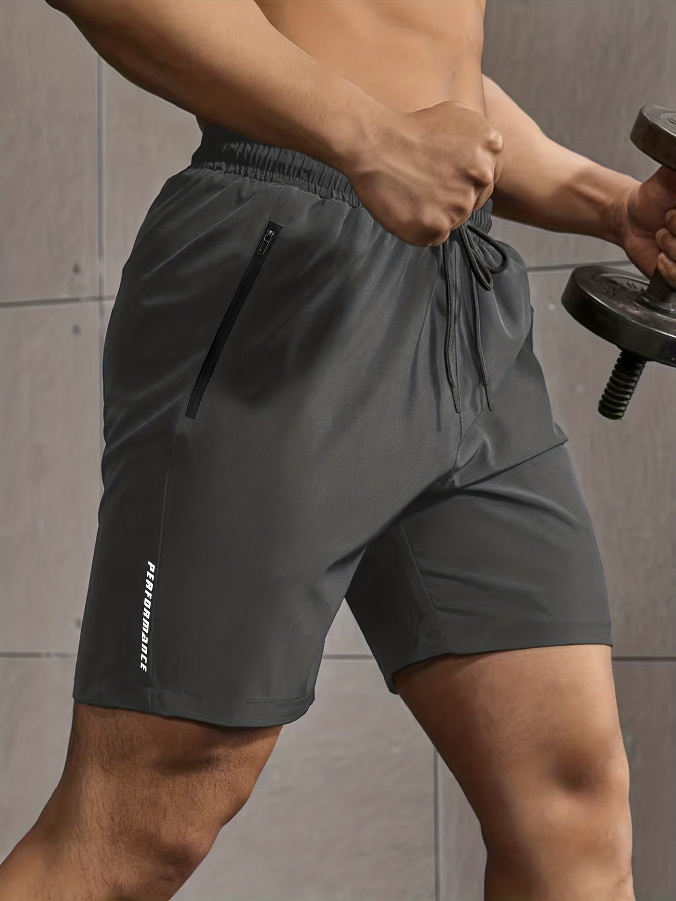 Men's casual style shorts with zip pockets, drawstrings, and performance letter print, ideal for summer outdoor activities.