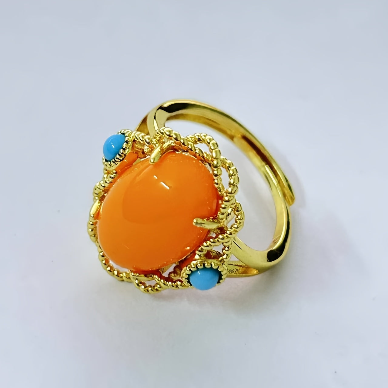 Vintage vacation style Claddagh ring featuring synthetic amber and turquoise stones, crafted with 18K golden plated 925 silver. The ring has an adjustable opening and is perfect for both daily wear and special occasions. This handcrafted personalized