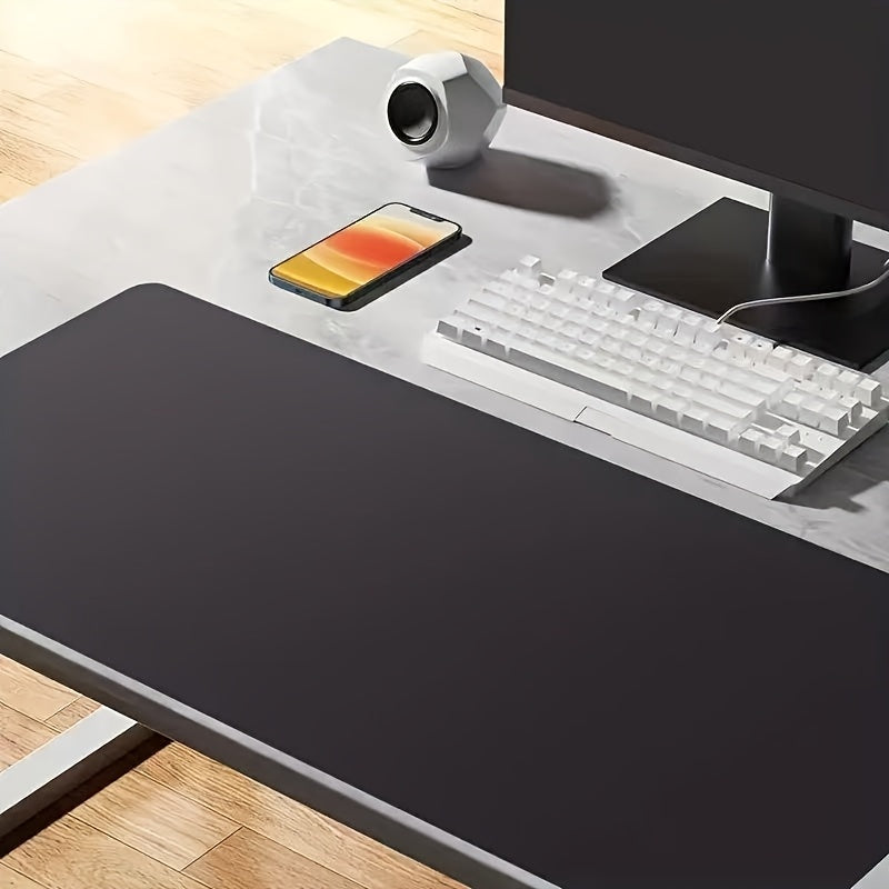 Black non-slip desk mat for office, ideal for computer and mouse.