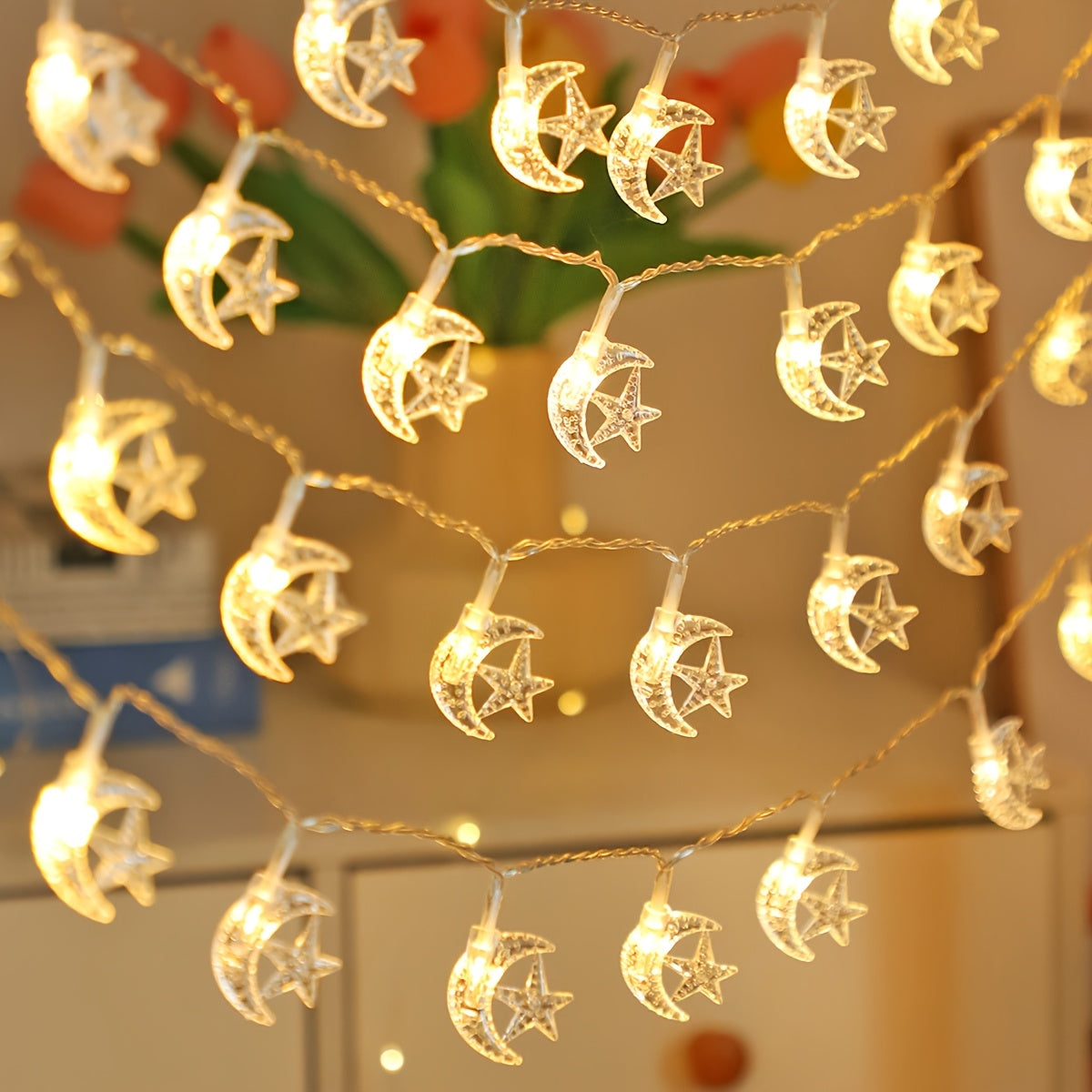 LED string lights with classic star and moon design, battery operated for indoor decor, ideal for bedrooms, walls, Ramadan, Eid, weddings, and parties.