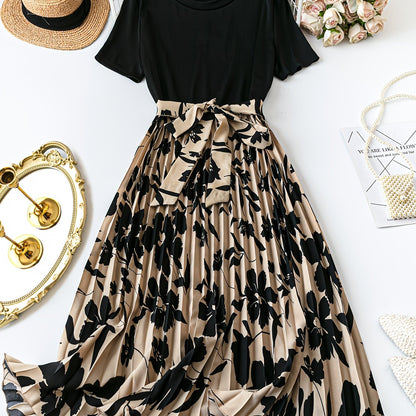 Plus size sleeveless floral print dress with ruffle detail in black and beige, perfect for spring/summer casual to semi-formal wear.