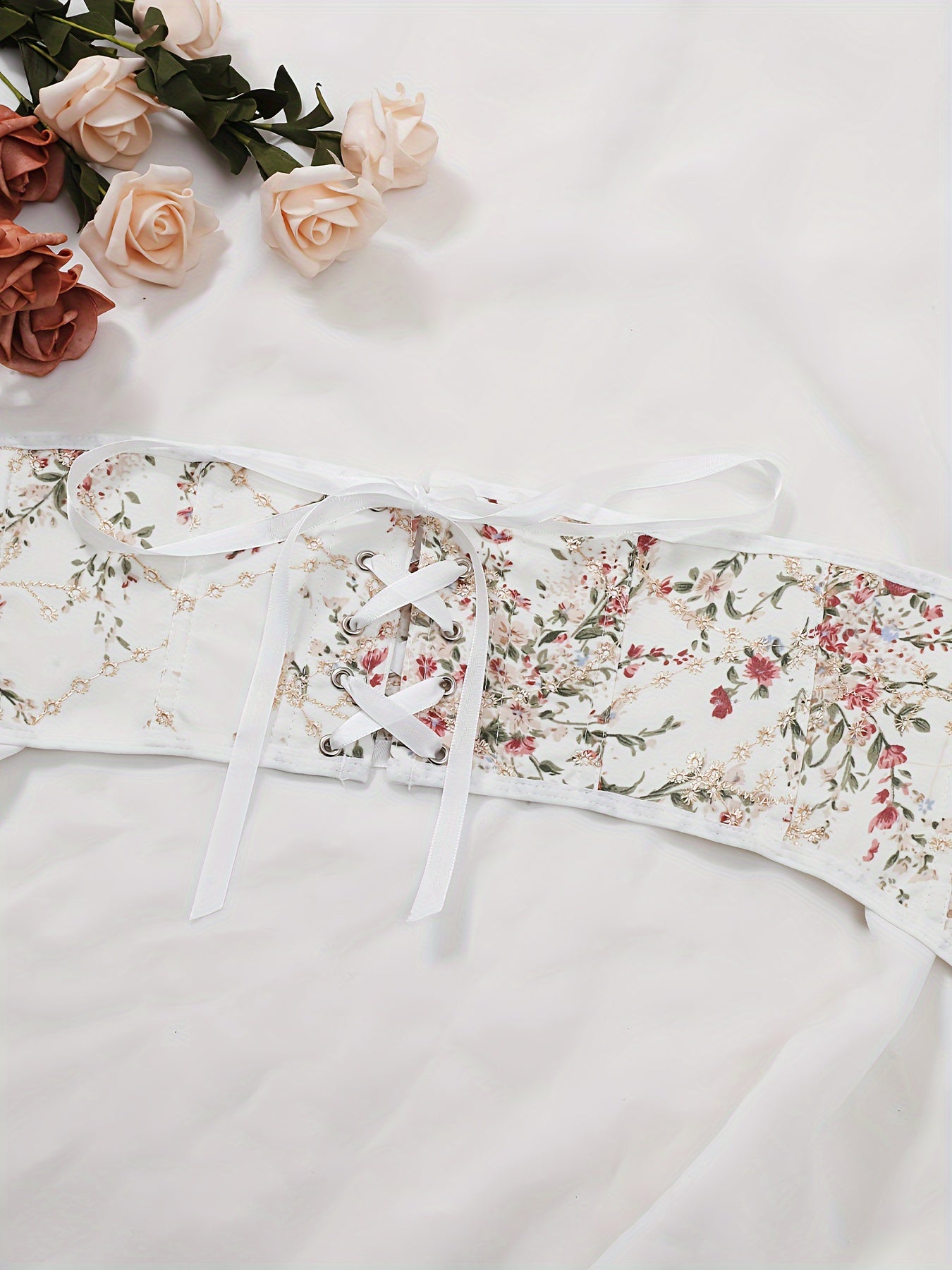 Women's elegant floral pattern girdle with lace-up back and buttons, a stylish and sexy fashion design.