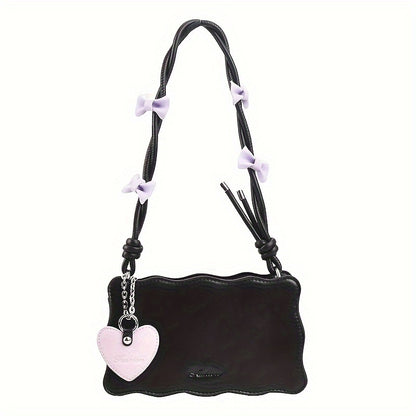 Baguette shoulder bag made of PU material with butterfly bow accents. Versatile and chic fashion accessory.