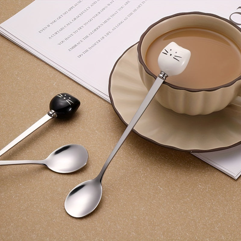 Charming stainless steel coffee stirrers with whimsical ceramic kitty spoons.