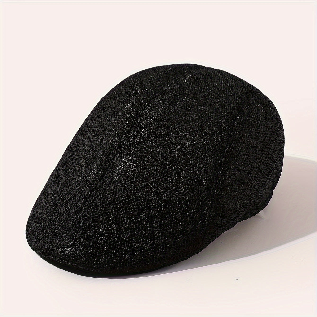 Breathable black mesh beret hat, adjustable for outdoor activities.