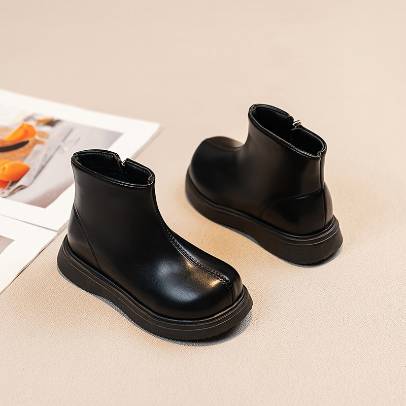 Warm fleece-lined kids' boots with soft soles and zip closure, ideal for outdoor activities in fall and winter.