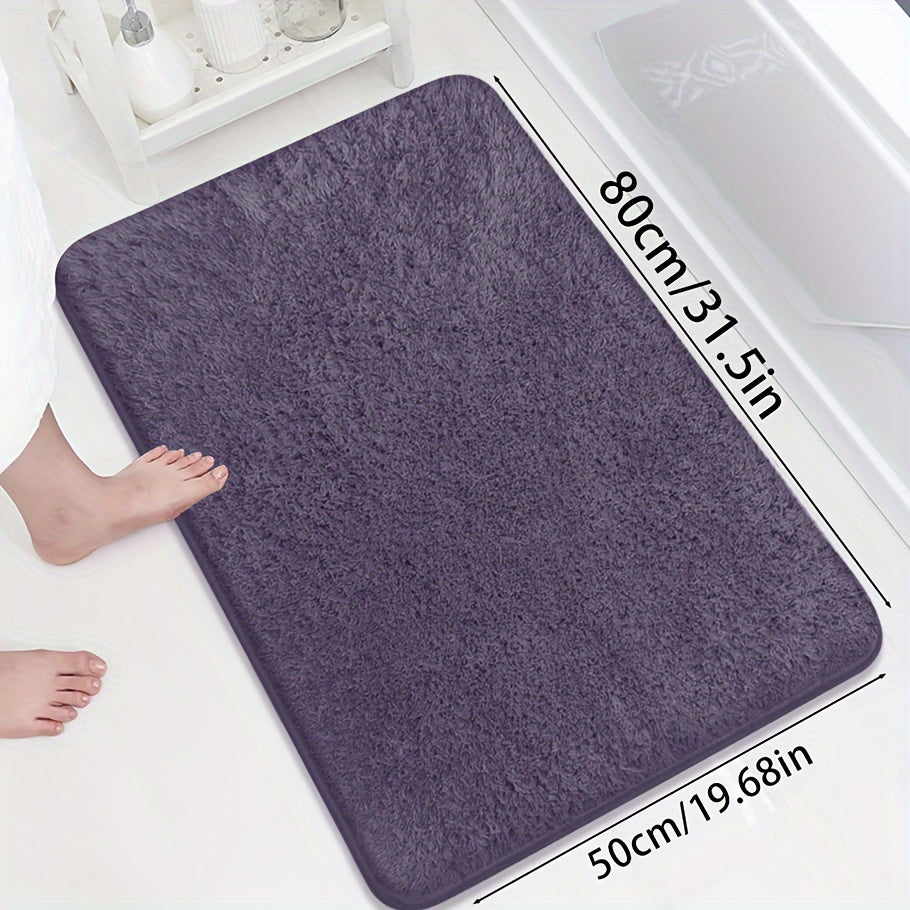 Soft and sumptuous purple bath mat offering luxury feel - highly absorbent, non-slip and fade-resistant, ideal for bathroom, bedroom and laundry room décor. Made from durable polyester, easy to clean.