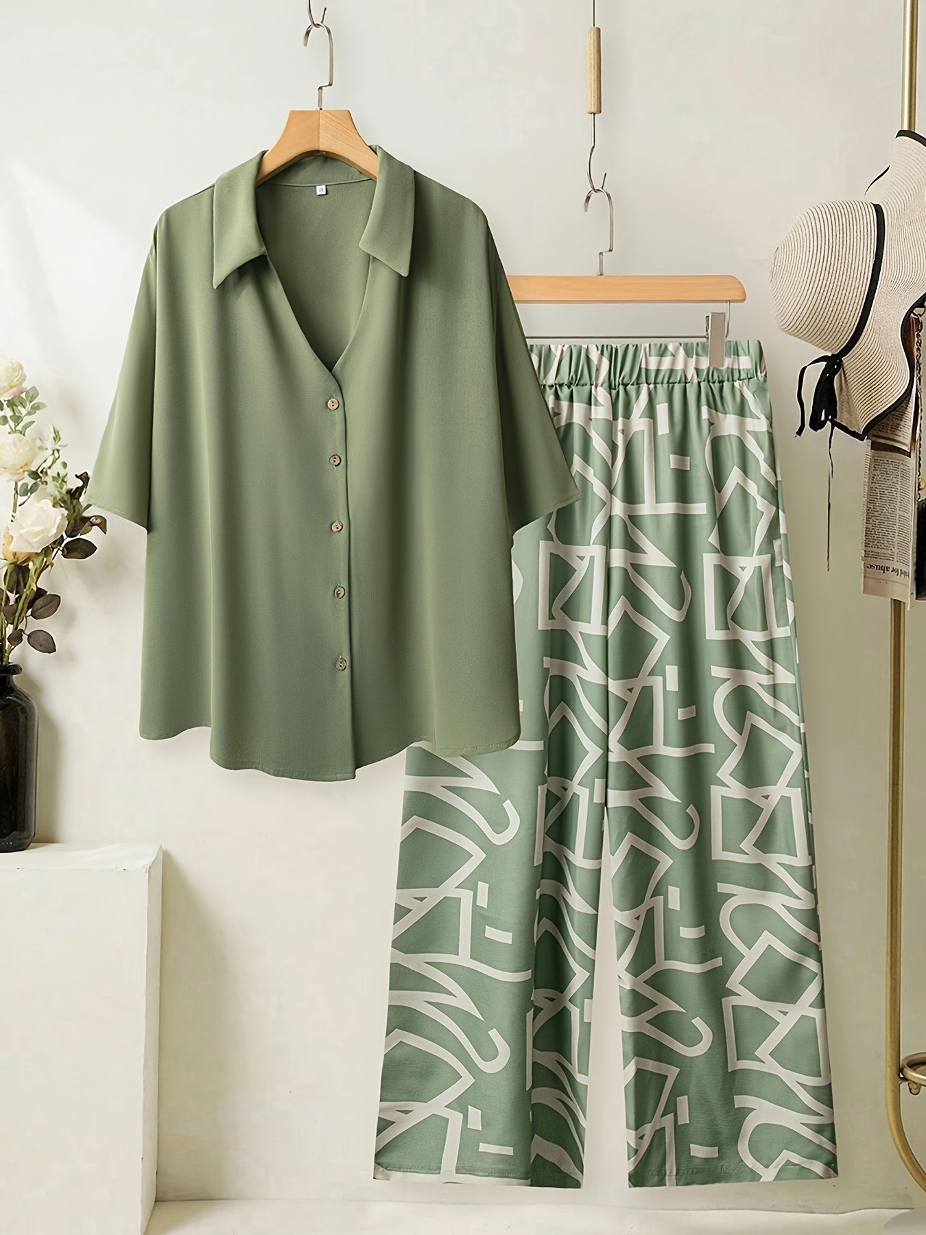 Women's large size elegant two-piece set - shirt and pants.