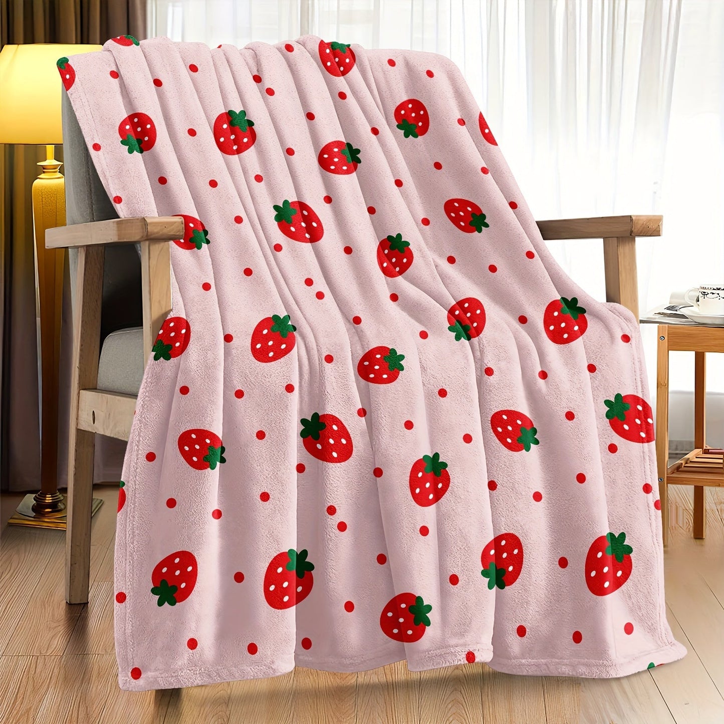 One piece of a strawberry printed throw blanket, perfect for bed, sofa, office, camping, or traveling. This soft and cozy blanket is versatile and makes a great gift for all seasons.