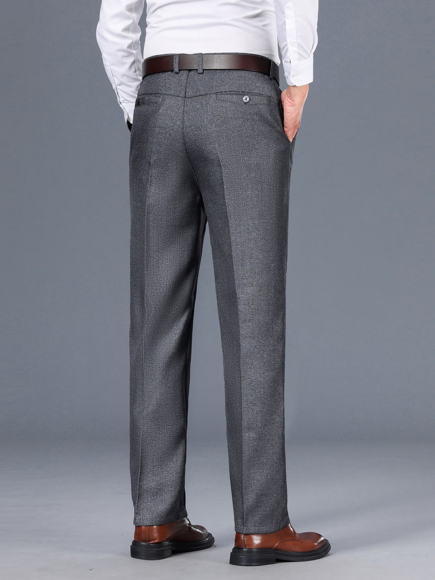 Gray dress pants for men with a straight fit, medium thickness, slant pockets, zip closure, and non-stretch polyester fabric. Suitable for business casual or formal wear in spring and