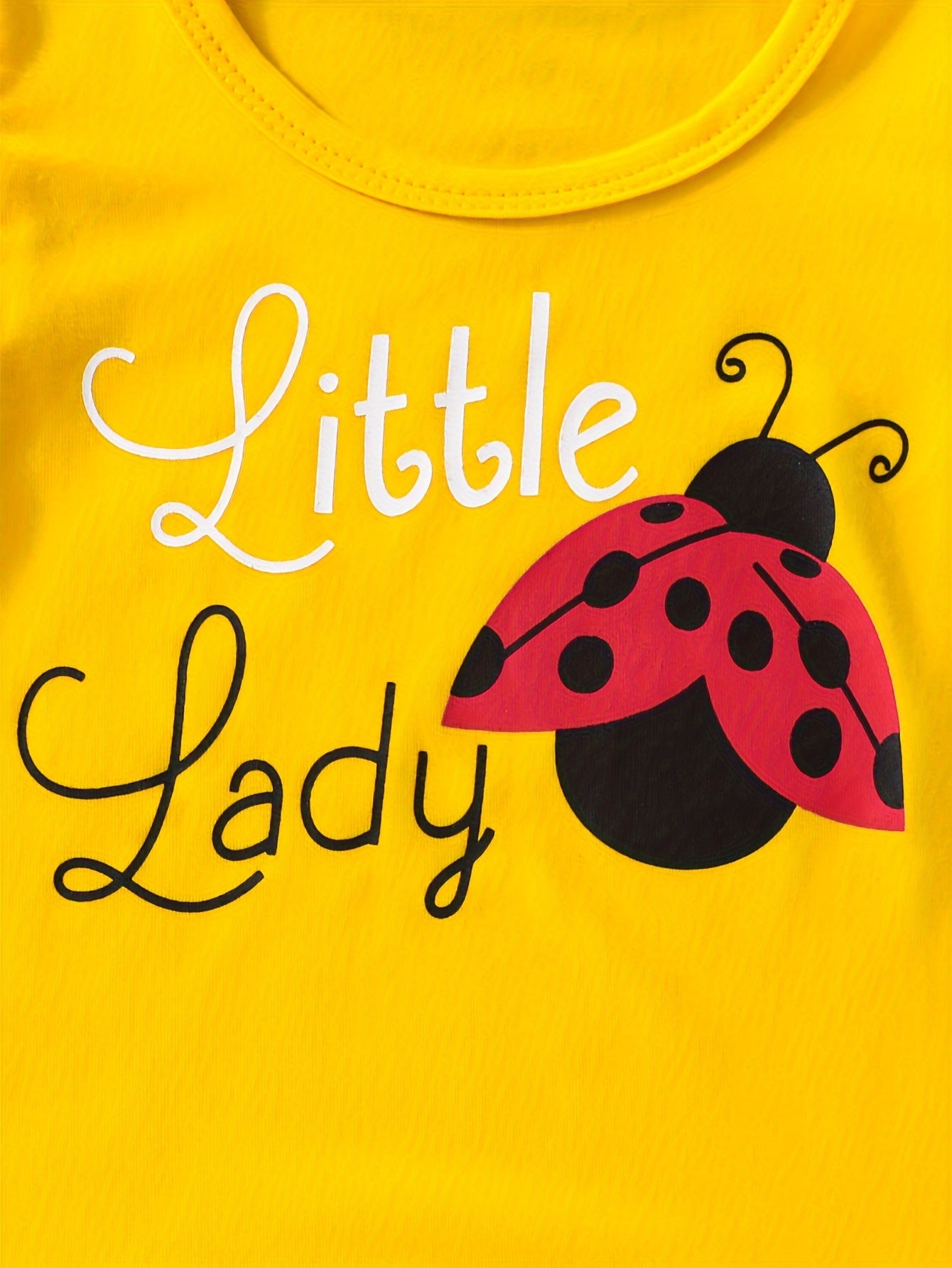 Ruffle sleeve graphic tee and ladybug shorts set for baby girl, perfect casual summer outfit.