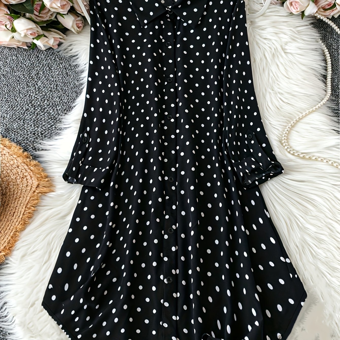 Polka dot print dress with button front and long sleeves for plus size women.