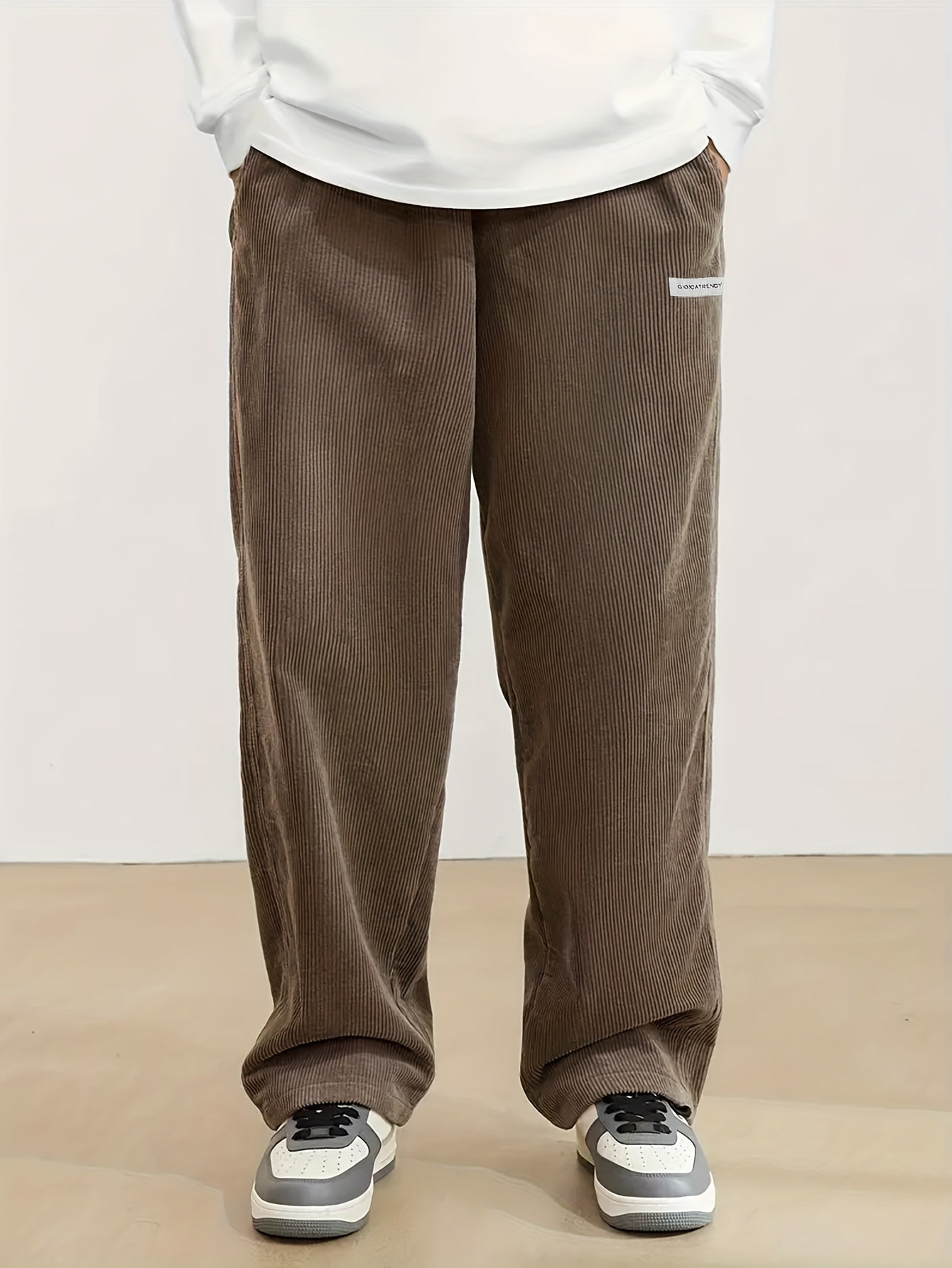 Men's casual corduroy pants with drawstring waist, ideal for outdoor activities and commuting.