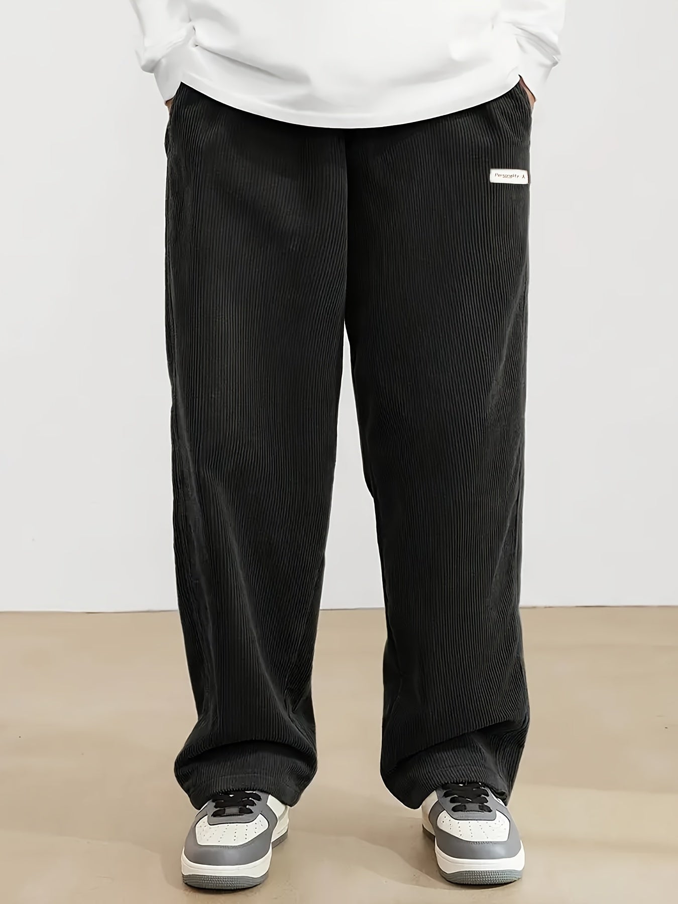 Men's plus size corduroy pants with pocket detail for fall/winter, featuring a letters print.