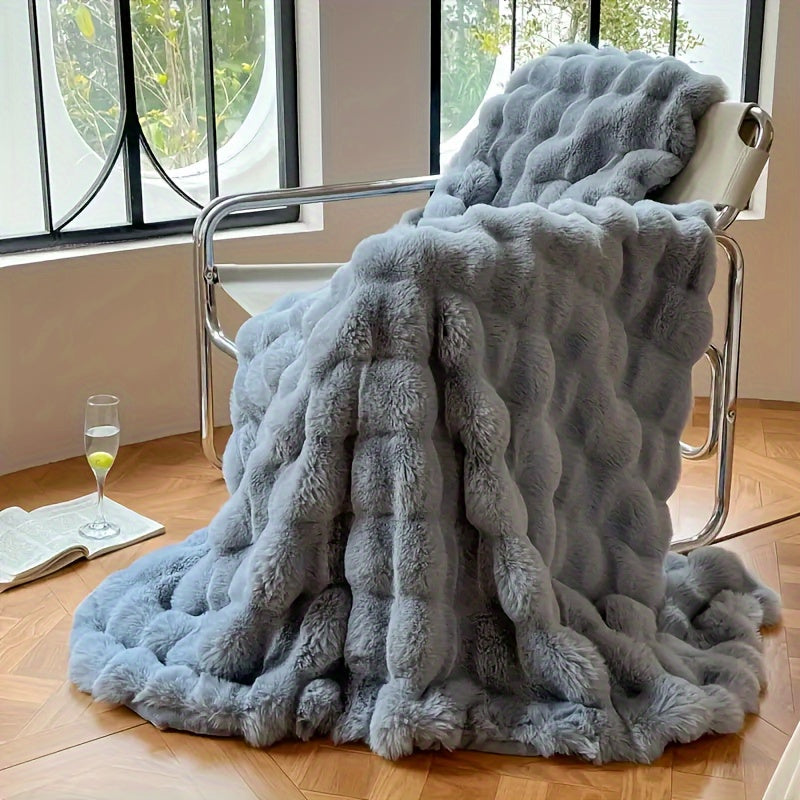 This high quality faux rabbit fur blanket is super soft, comfortable, and warm. It is perfect for all seasons and is ideal for use in the bedroom, office, camping, travel, or as home decoration.