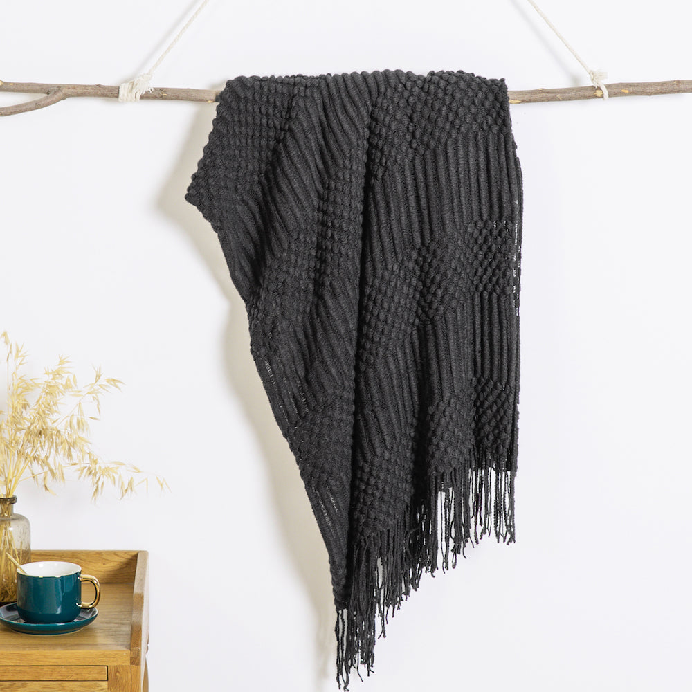 Textured throw blanket made with soft, solid knitted fabric, perfect for decorating your sofa or couch. Measures 127.0cm x 152.4cm.