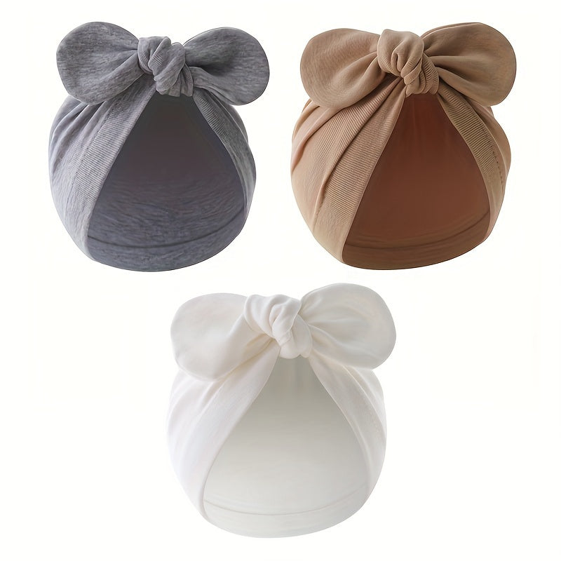 Three-pack of cotton baby turban hats with bow, suitable for newborns to 3 years old. Hand washable and lightweight, perfect for birthdays and fantasy themes.