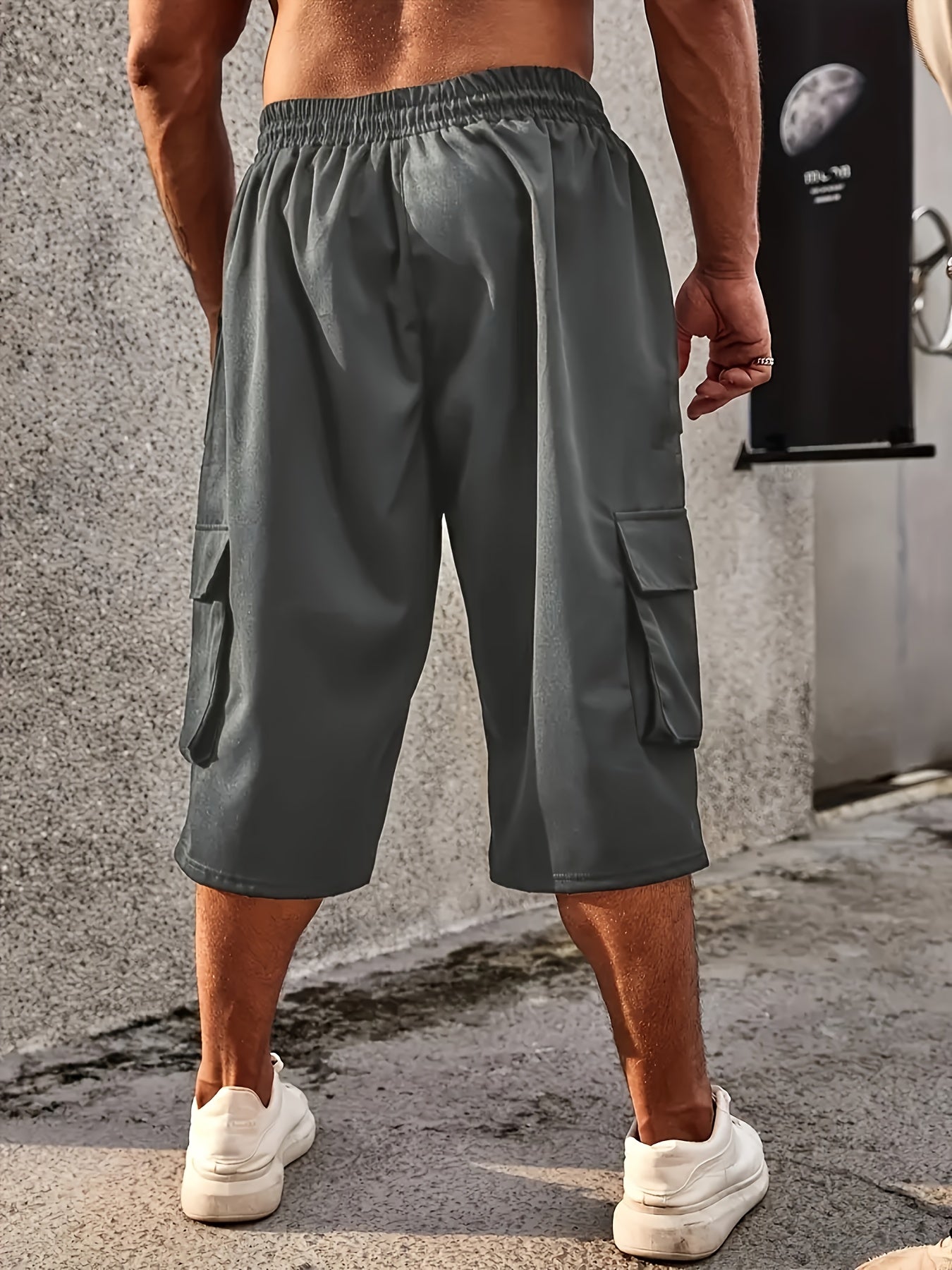 Men's plus size cargo pants with drawstring and pockets, loose fit, and comfortable breathability.