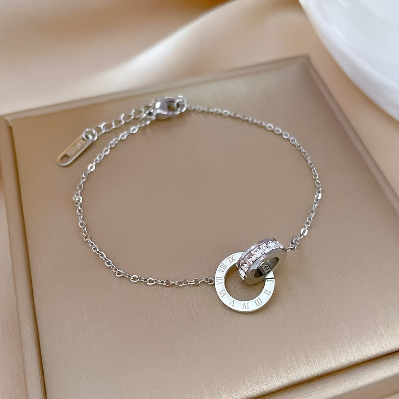 Stainless steel bracelet with double-loop Roman numerals and zirconia, perfect for daily wear for women.