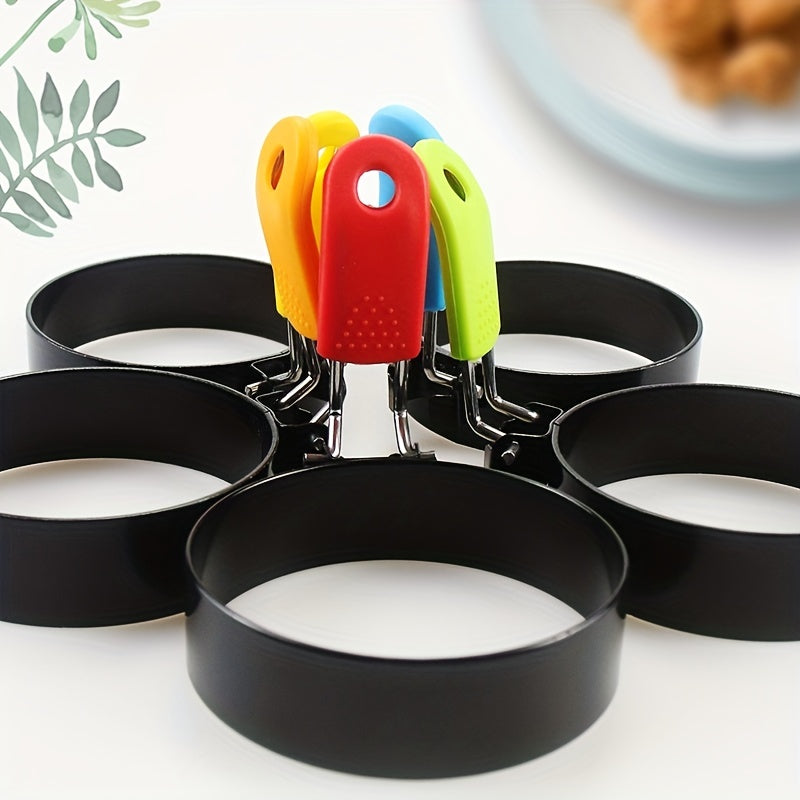 4 stainless steel egg cooking rings for making round pancakes, frying eggs, and omelets. Perfect for your kitchen gadgets and accessories.