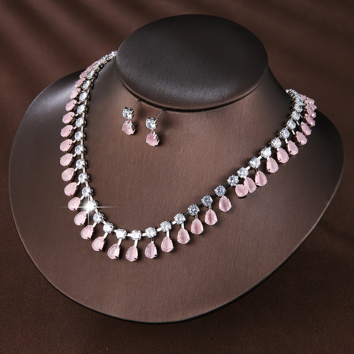 New European and American style set of three elegant jewelry pieces for ladies, including earrings and necklace adorned with luxurious zirconia. Perfect for bridal wedding events or formal banquets, this set is both fashionable and chic.