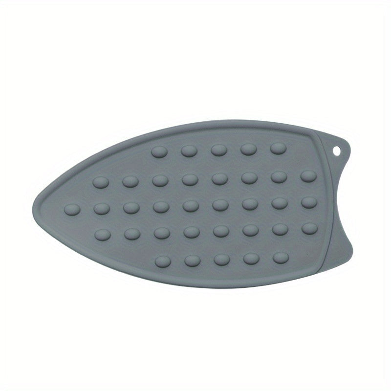 Multi-functional ironing mat made of silicone - easily foldable, extra thick and waterproof, with a non-slip backing. Ideal for use in apartments, dormitories, and travel.