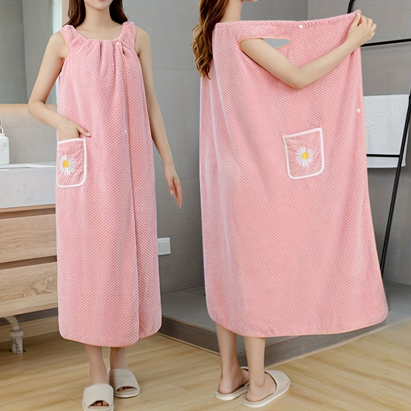 Adults' wearable bath towel features pockets, buttons, and quick-drying, absorbent material. Perfect for home spa or sauna use.