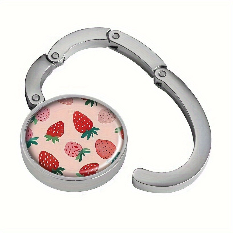 Stylish Pink Strawberry Folding Purse Hanger - Convenient Handbag Hook for On-the-Go, Perfect for Gifting during Holidays and Travel.