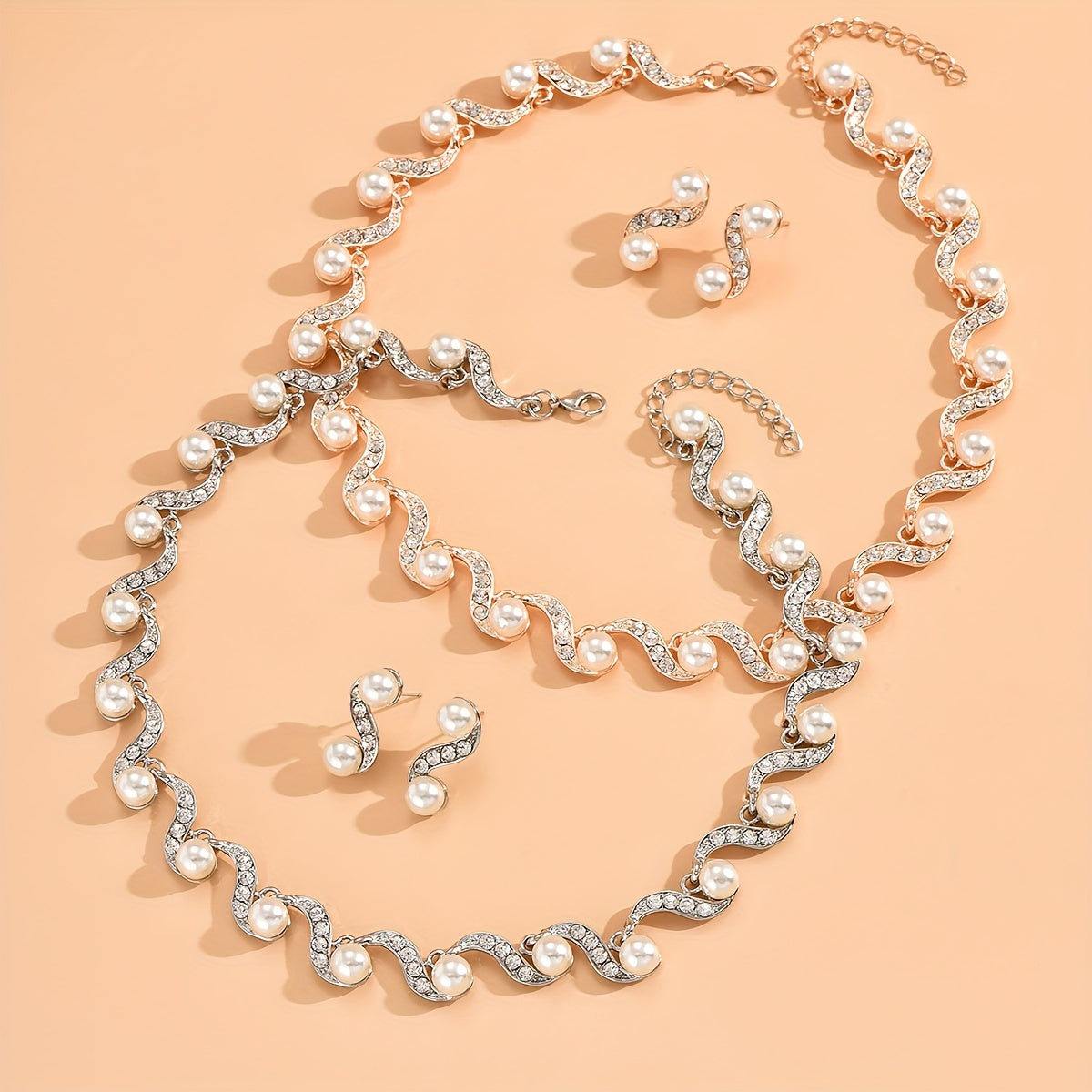 Stunning imitation pearl and diamond jewelry set, ideal for brides to wear on their special day.