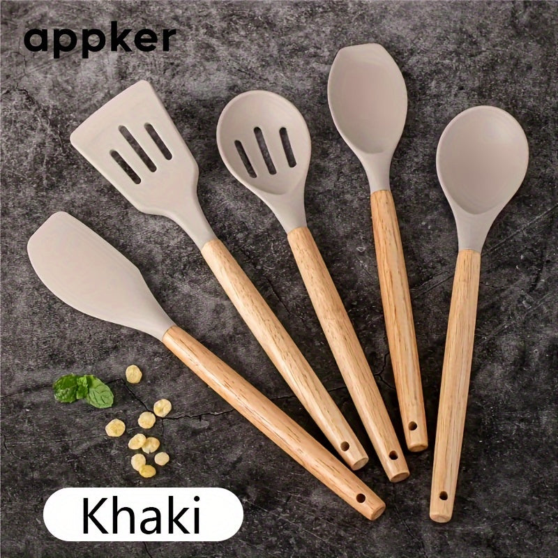 Appker's 5-piece Silicone Kitchen Utensil Set features Non-Stick, Safe Cooking Tools with Wooden Handles. Washable and Modern, this set is Perfect for Home Chefs.