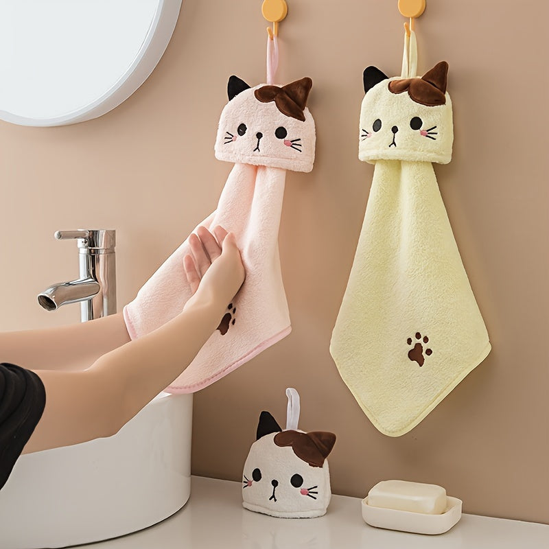 Soft coral fleece hand towel embroidered with a cat design - cute and absorbent for kitchen and bathroom use.