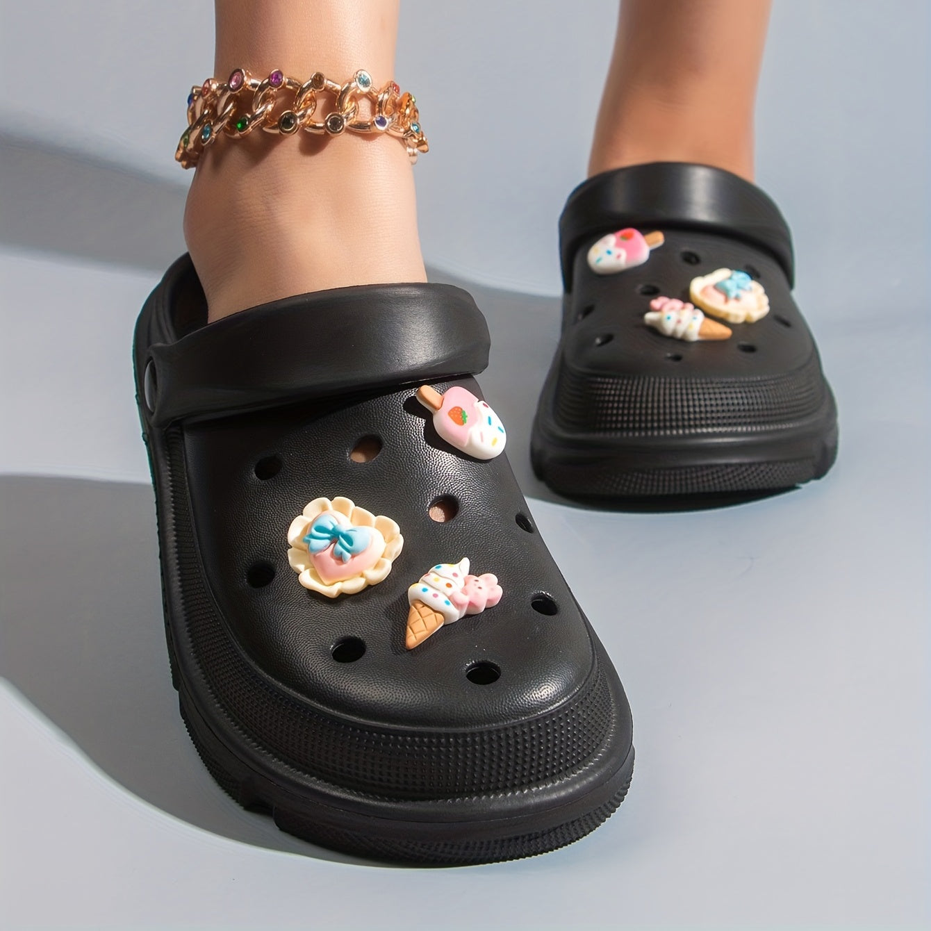 Women's cute cartoon clogs with round toe and breathable design for comfortable wear.