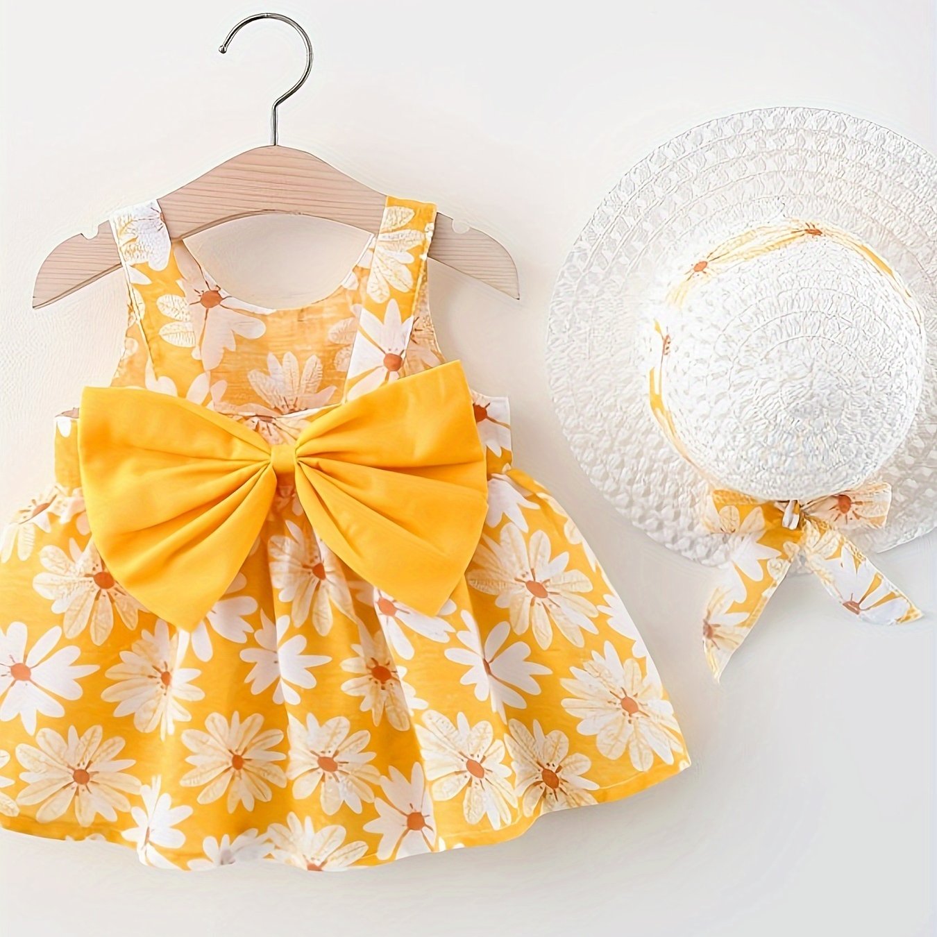 Summer dress with flower print, big bow, and matching hat set for baby girls.