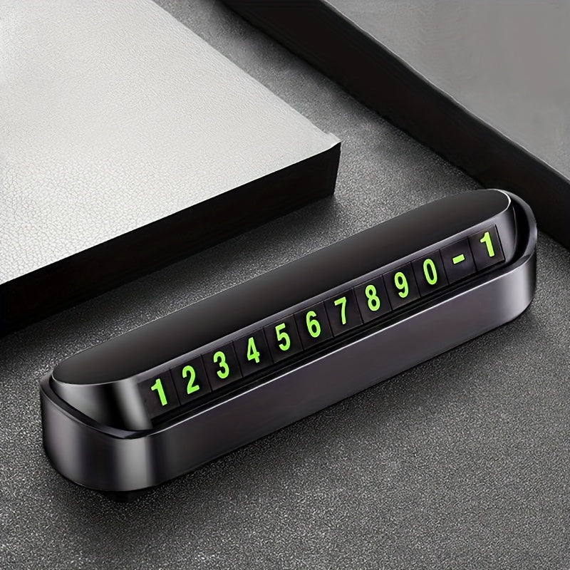 Night-visible, durable plastic dashboard parking number sign for easy contact.