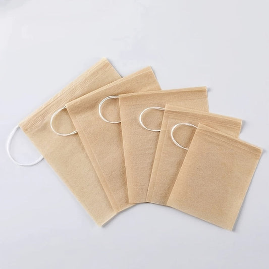 Pack of 100 Natural Biodegradable Drawstring Filter Paper Bags for Coffee, Tea, and Food - Convenient and Eco-Friendly - Disposable Tea Brewer and Empty Tea Bag infused with Pine Leaf Powder and Herbs - Ideal for Brewing and Serving