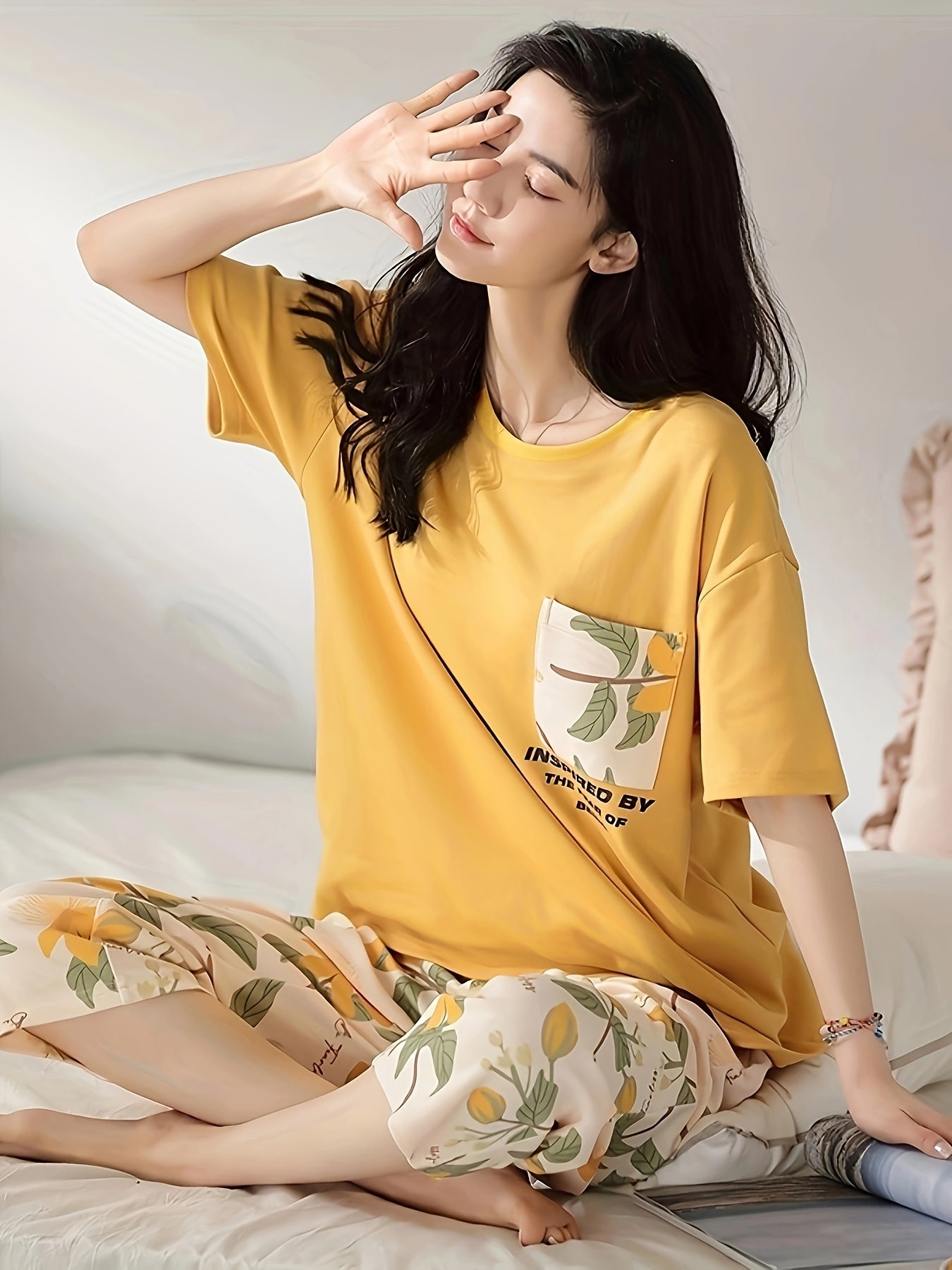 Floral print casual loungewear set for women: short sleeve tee and capri pants for a cozy, relaxed fit at home in summer.