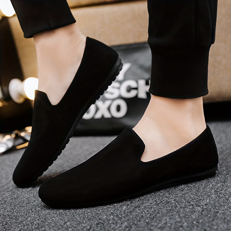 Men's black slip-on loafers with round toe and PVC sole for fashionably casual everyday wear in Spring/Summer 2024.