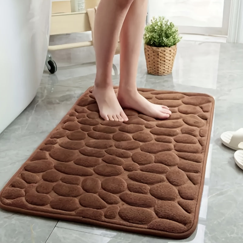 Luxurious red memory foam bath mat with geometric pattern for bathroom floors. Non-slip, soft polyester material that is quick-drying and absorbent. Hand washable, fragrance-free with a textured surface and machine-knit design. Perfect for a quick dry