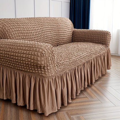 Seersucker skirt sofa cover protects couch from cat scratches in bedroom, office, or living room.