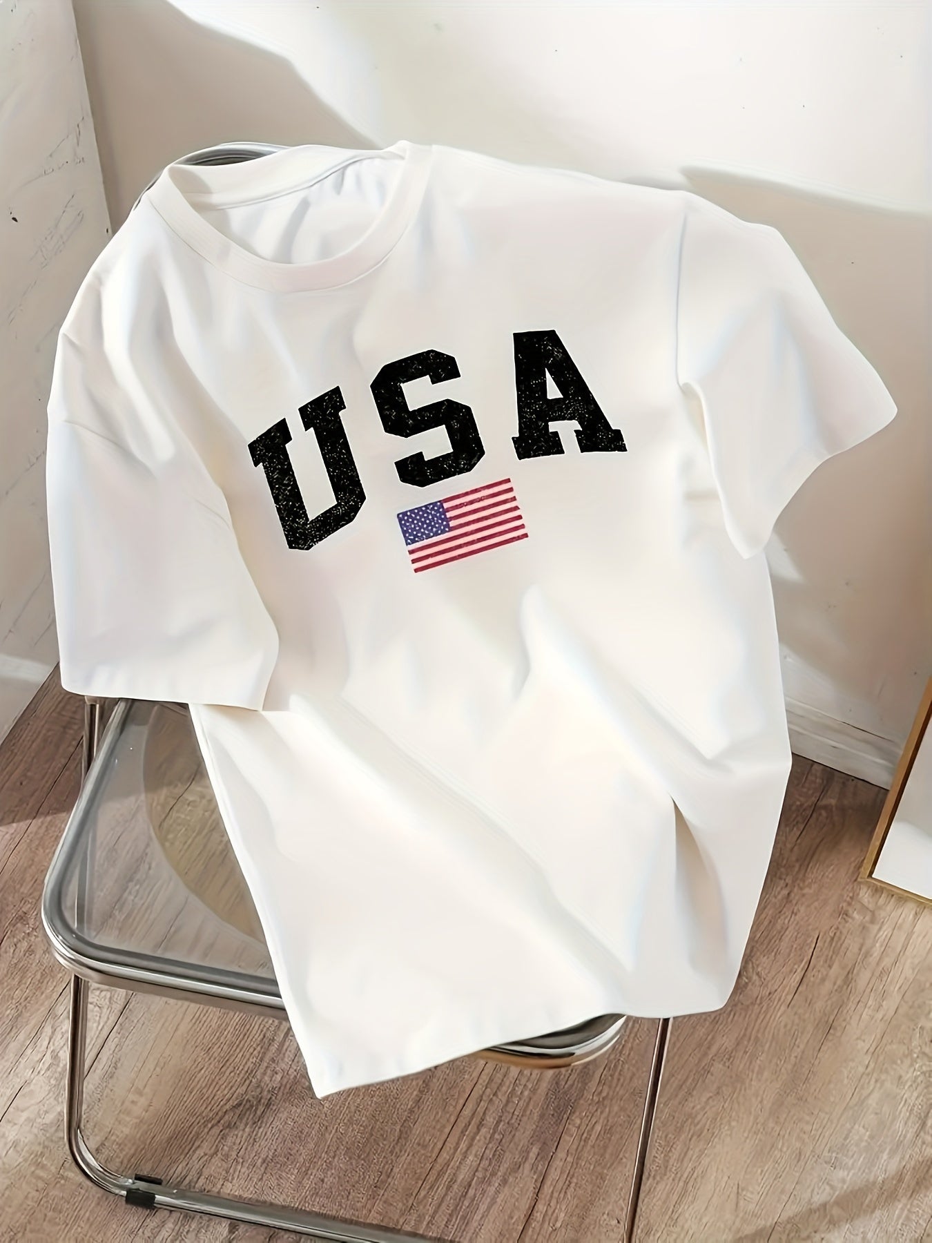 Women's USA flag print t-shirt with round neck and short sleeves. Made of 100% polyester, machine washable and semi-sheer. Suitable for all seasons.