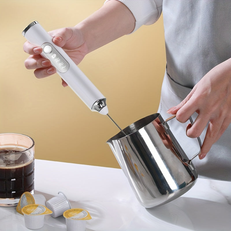 Portable USB rechargeable milk frother and coffee maker with automatic function, whisk attachment, and 1200mAh battery. Comes with measuring spoon and cup. Perfect for use at home or when traveling.