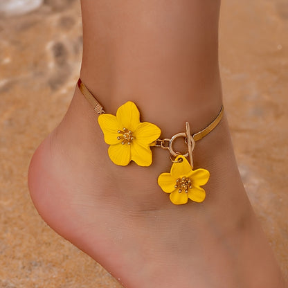 Stylish gold-tone anklet with white flower charms, perfect for vacations and everyday wear.