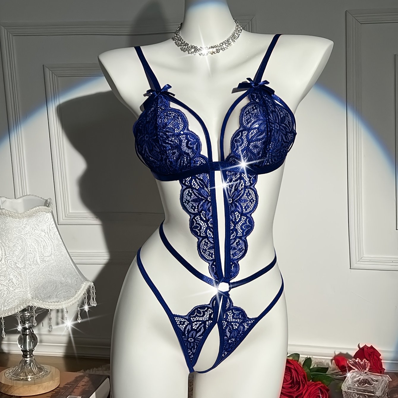 Flower lace teddy with open crotch and sexy bow bodysuit. Flirty lingerie for women.