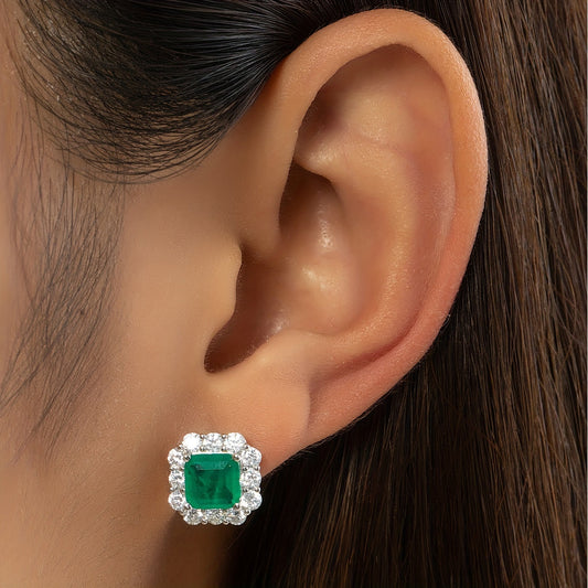 Vintage style earrings made of S925 silver, embellished with Moissanite and synthetic gemstones resembling emeralds.