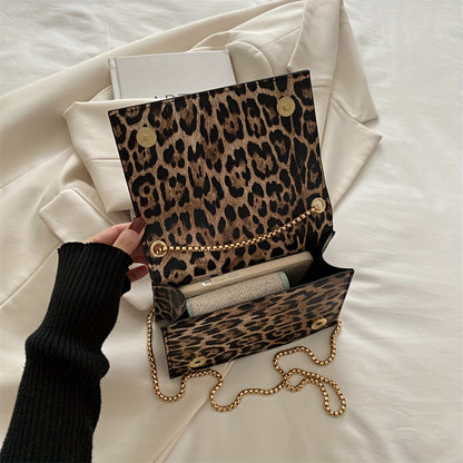 Stylish leopard print crossbody bag for women in black synthetic leather with golden-tone chain strap. Magnetic closure and large capacity, suitable for work, travel, and everyday use.